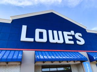 a blue "lowe's" sign in front of a building