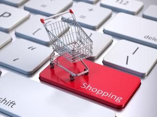 a shopping cart on a computer key that says "shopping"