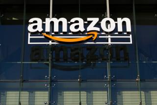 The Amazon logo hanging on a building.