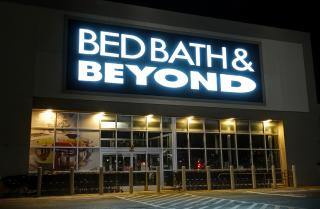 A Bed Bath & Beyond store at night.