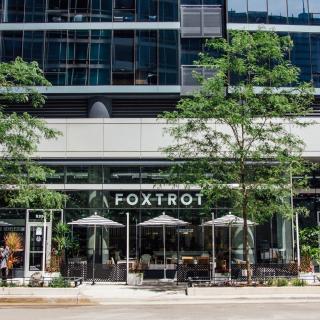 A photo of a Foxtrot store with tress in front.