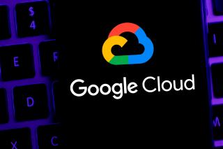 The Google Cloud logo on top of a laptop keyboard.