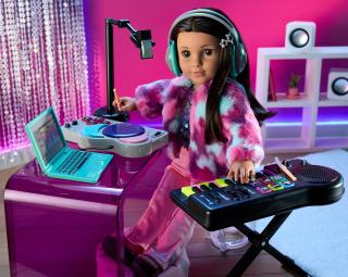 American Girl doll promotional photo showing doll Kavi Sharma with accessories.
