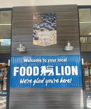 A banner that says "Welcome to your local Food Lion. We're glad you're here!"