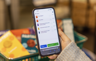 An iPhone with Instacart's Scan & Pay interface.