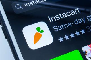 The Instacart logo on an iPhone.