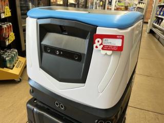 The Cobi 18 robot inside a Kum & Go store.