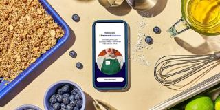 A graphic showing an iPhone on a table with the Instacart Business app open.