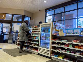 A shopper checks out at a Rite Aid store.