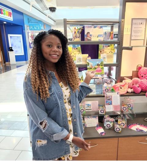 a woman standing in front of a store