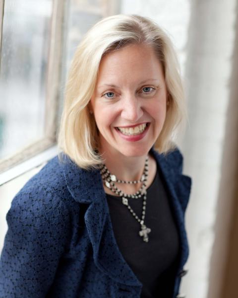 a woman smiling for the camera