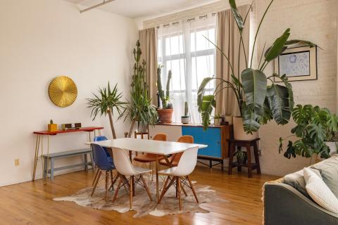 a living room filled with furniture and a large window