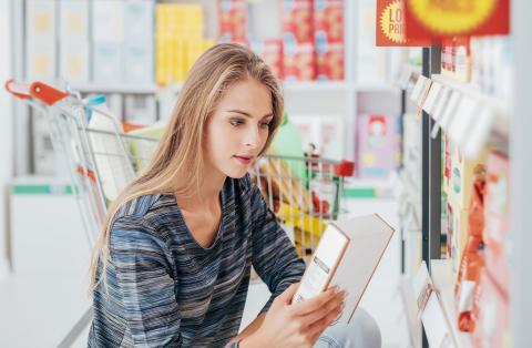 a woman looking at a box