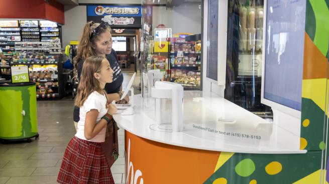 a person standing in front of a store