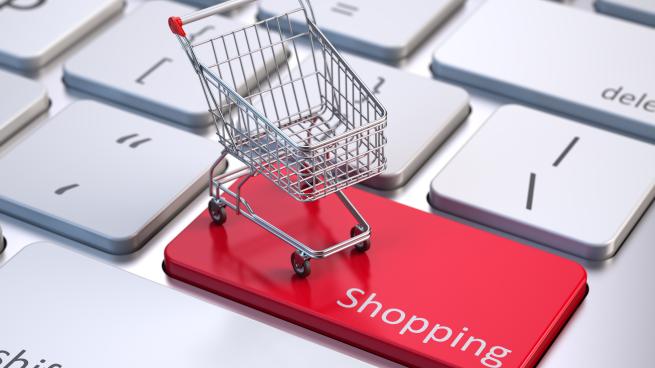 a shopping cart on a computer key that says "shopping"