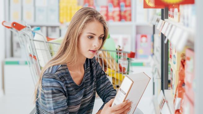 a woman looking at a box