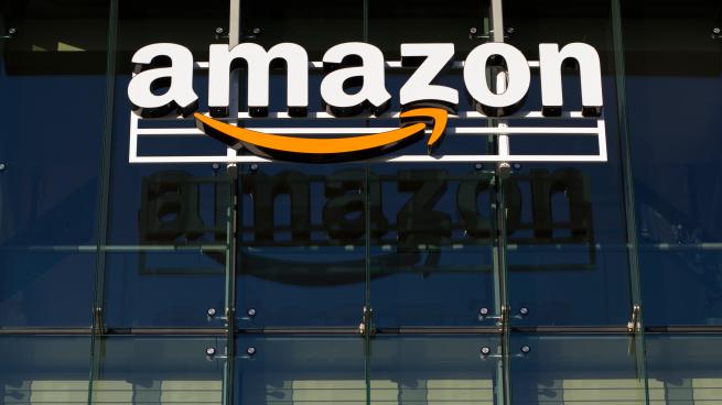 The Amazon logo hanging on a building.