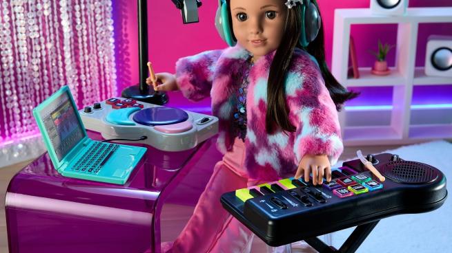 American Girl doll promotional photo showing doll Kavi Sharma with accessories.