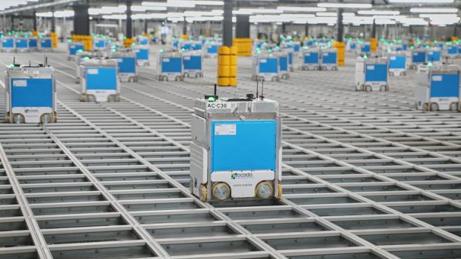 A Kroger delivery robot in a fulfillment facility.