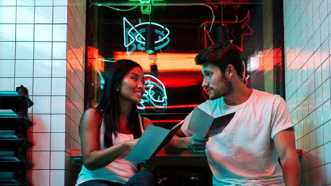 couple looking at a menu