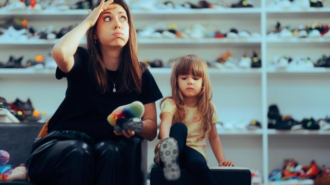 stress mom shopping for shoes with kid
